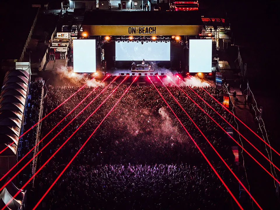 Fans celebrating at On The Beach music festival